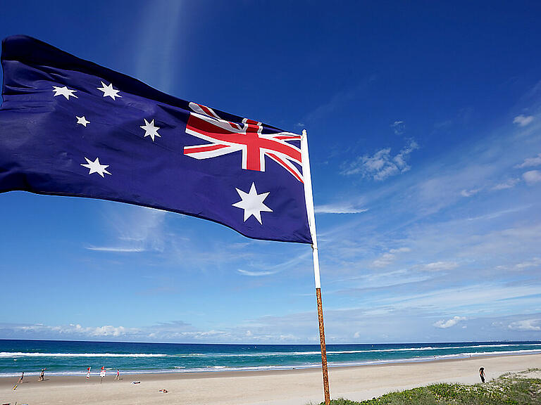 An Australian flag is seen at Main Beach on the Gold Coast, Tuesday, April 7, 2020. Australian Prime Minister Scott Morrison today urged all Australians to stay home over the Easter weekend amid the countrys coronavirus restrictions. Locally, the Gold Coast City Council is to close all car parks to beaches on the Gold Coast in a deterrent to travellers heading to the beach over the Easter weekend. (AAP Image/Dave Hunt) NO ARCHIVING